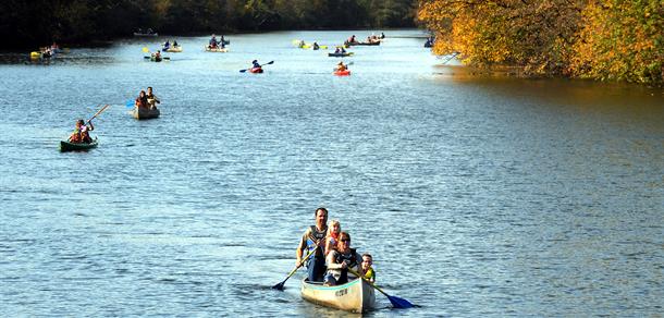Canoers and kayakers enjoying the river in Gallup Park.